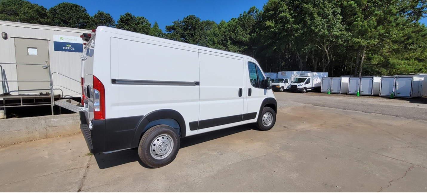 White Ram ProMaster refrigerated van parked outside, insulated for cold storage transport.