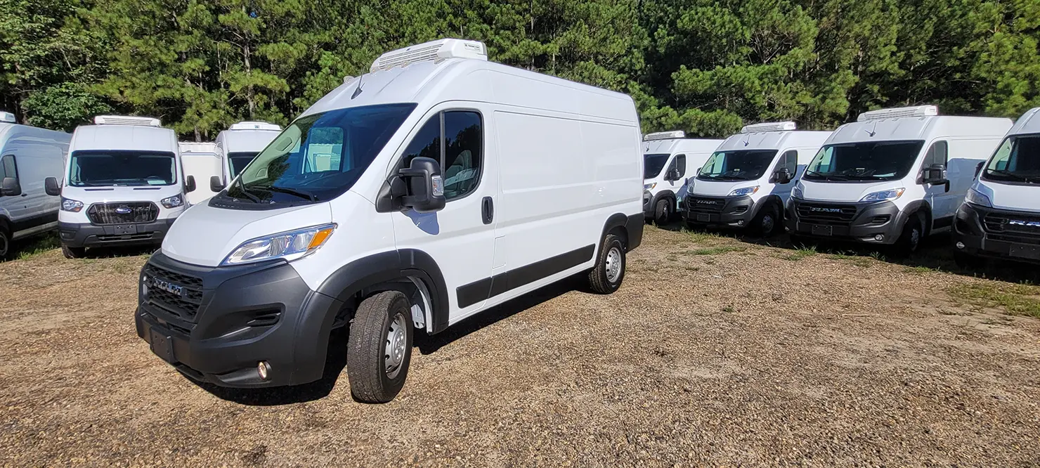 White Emerald refrigerated van with a roof-mounted refrigeration unit parked among other vans.