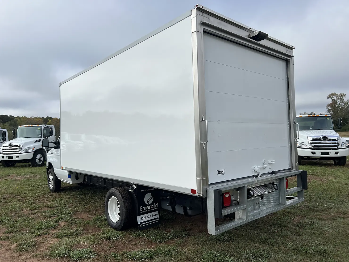 Rear view of an Emerald refrigerated truck equipped with an ICC bumper for safety and compliance.
